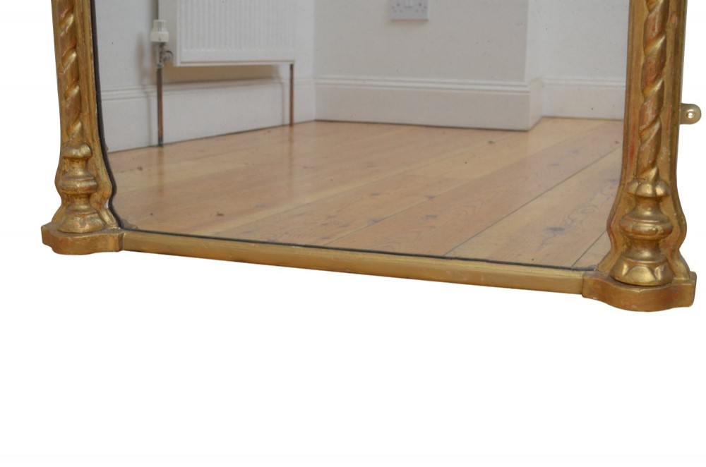 A tall nineteenth-century arched mirror featuring a gilded frame with a continuous carved rope twist motif. View IV