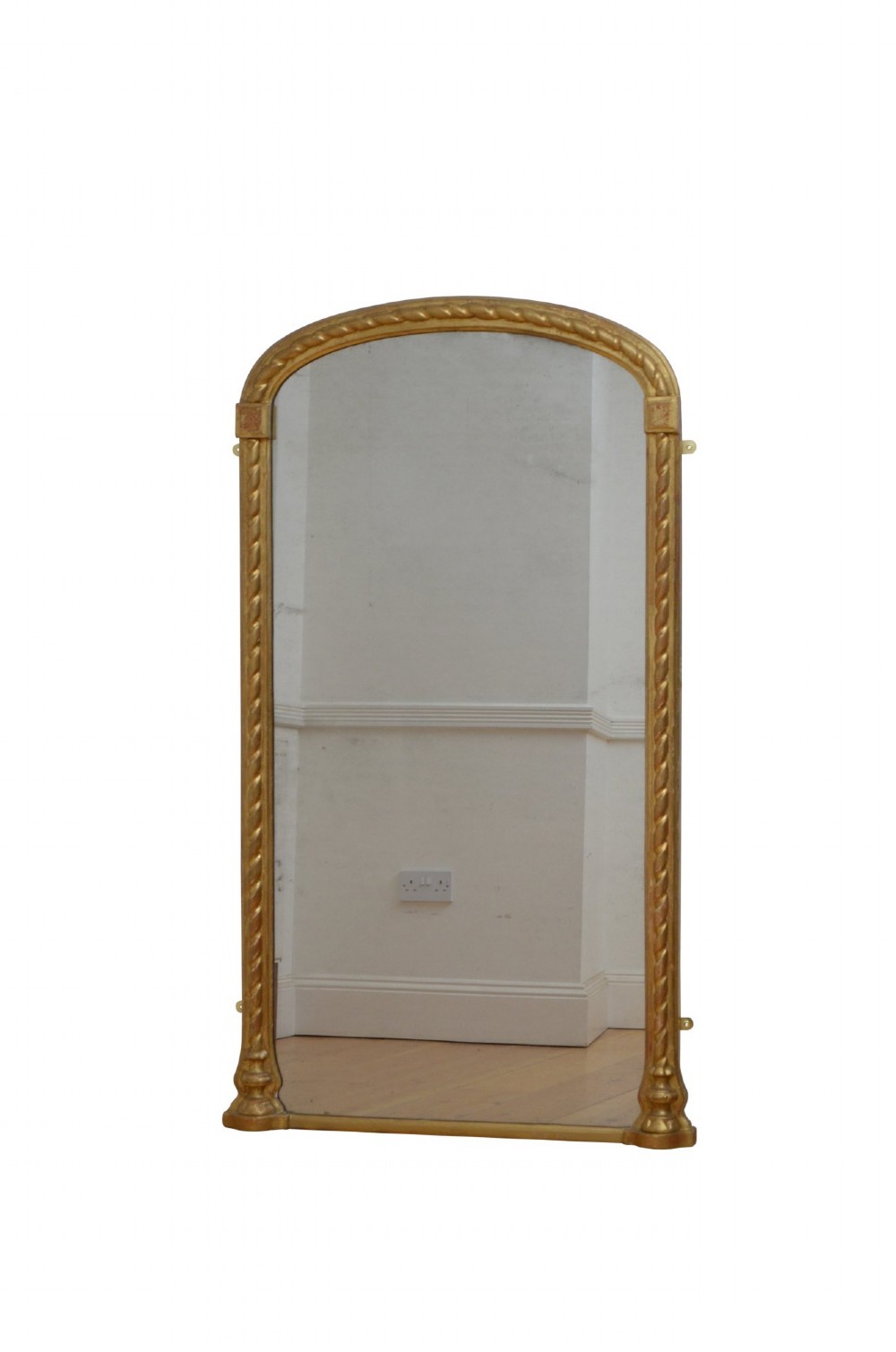 A tall nineteenth-century arched mirror featuring a gilded frame with a continuous carved rope twist motif. View VIII