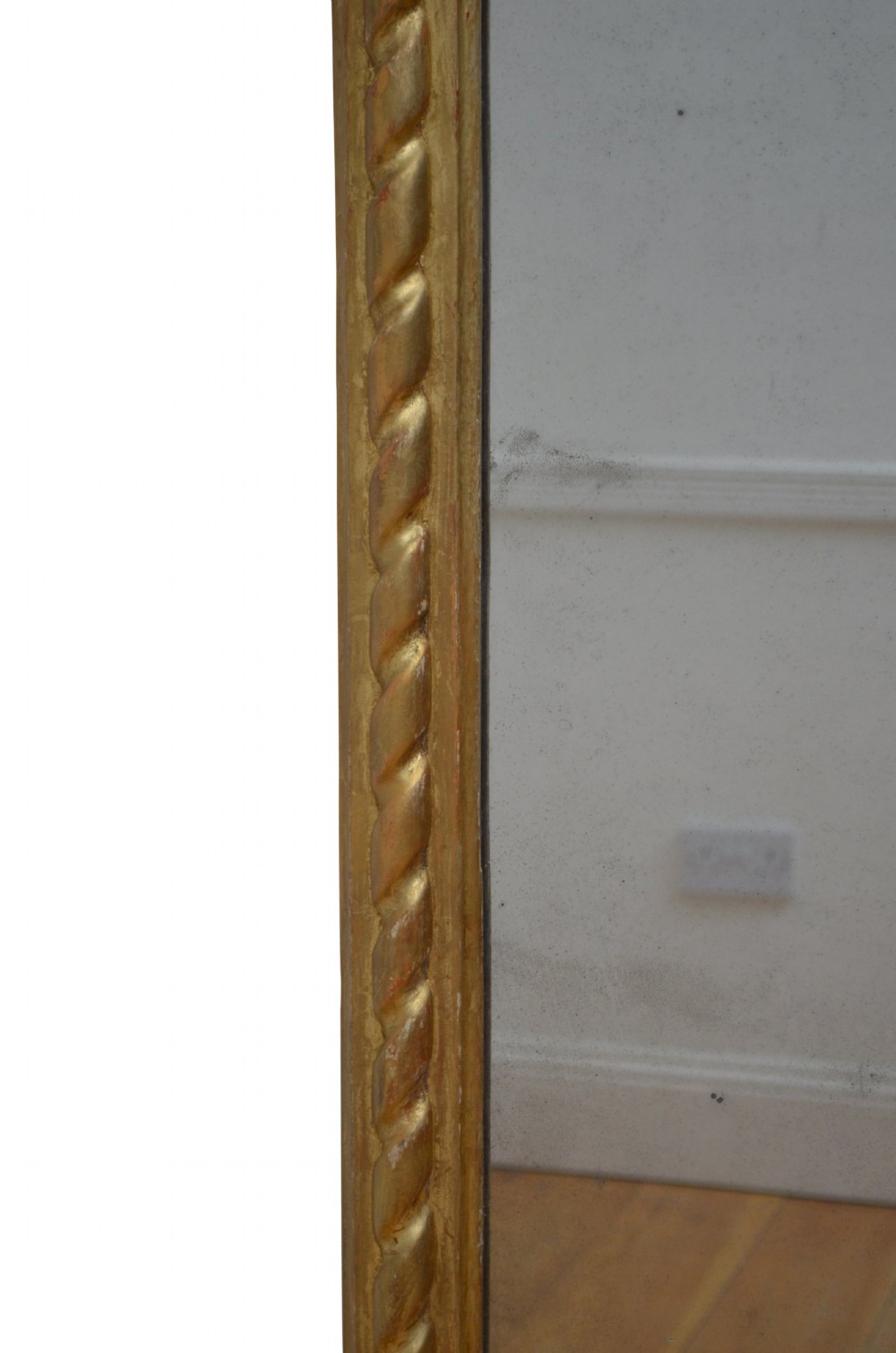 A tall nineteenth-century arched mirror featuring a gilded frame with a continuous carved rope twist motif. View X