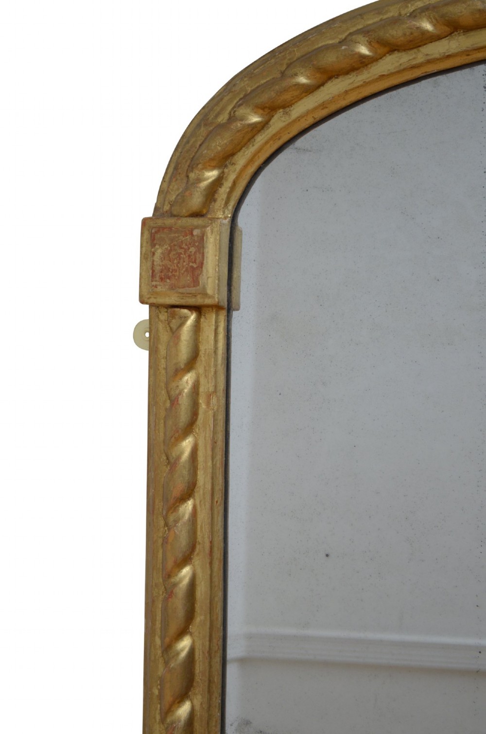 A tall nineteenth-century arched mirror featuring a gilded frame with a continuous carved rope twist motif. View XI
