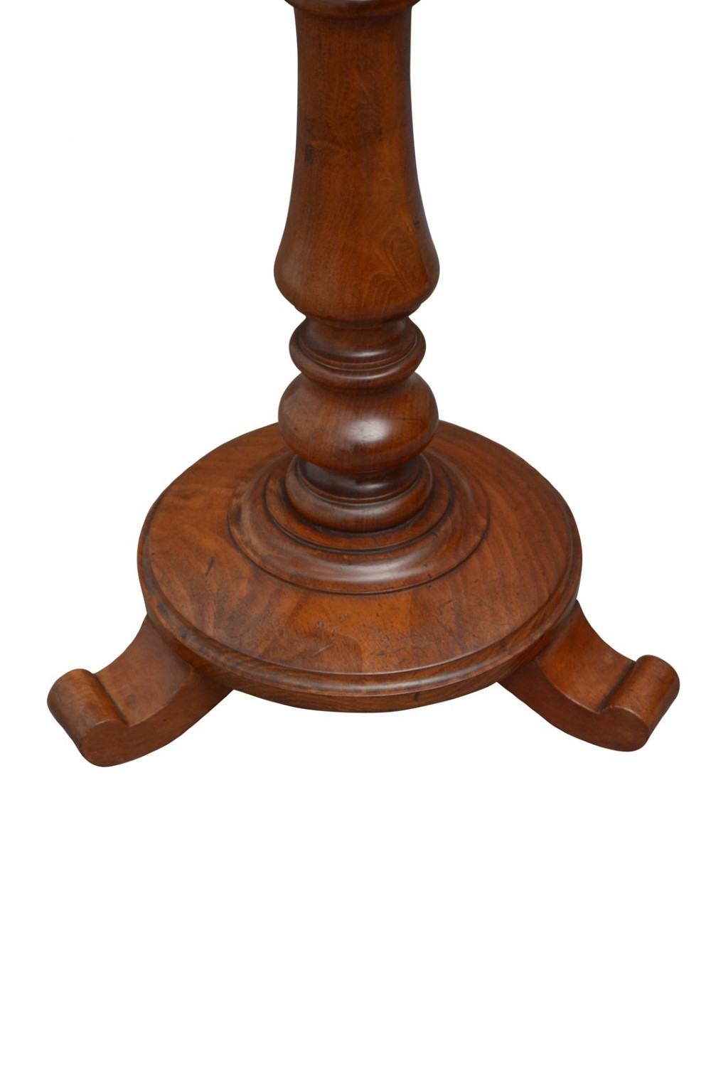 A William IV mahogany circular lamp table featuring a dark blue gilt-tooled leather inset top supported by a turned pedestal stem on a tri-form scroll-foot base. View VII