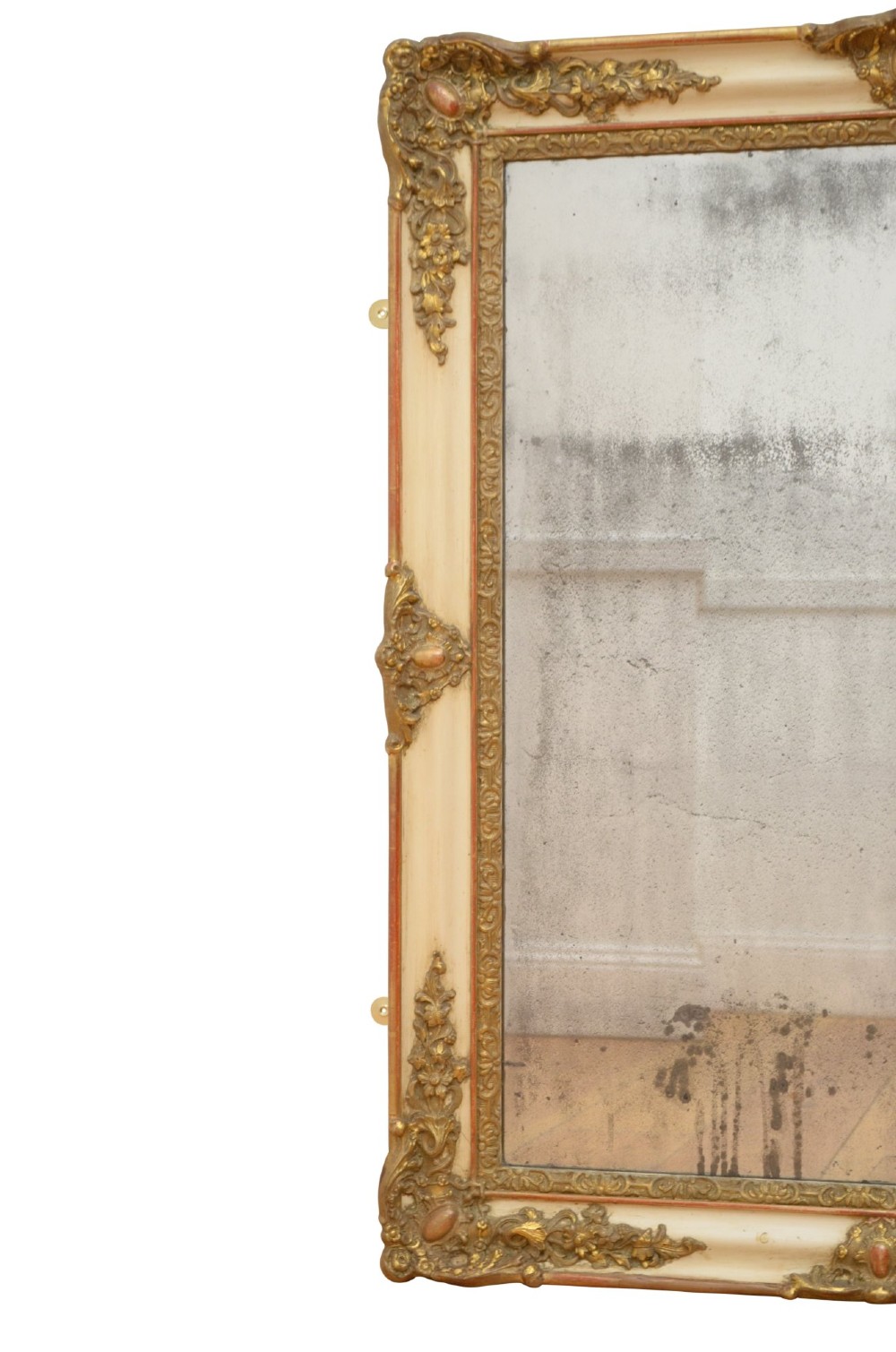 A rectangular 19th-century French Rococo wall mirror featuring an off-white frame decorated with ornate gold gilt gesso scrollwork and corner cartouches surrounding an aged glass plate. View VII