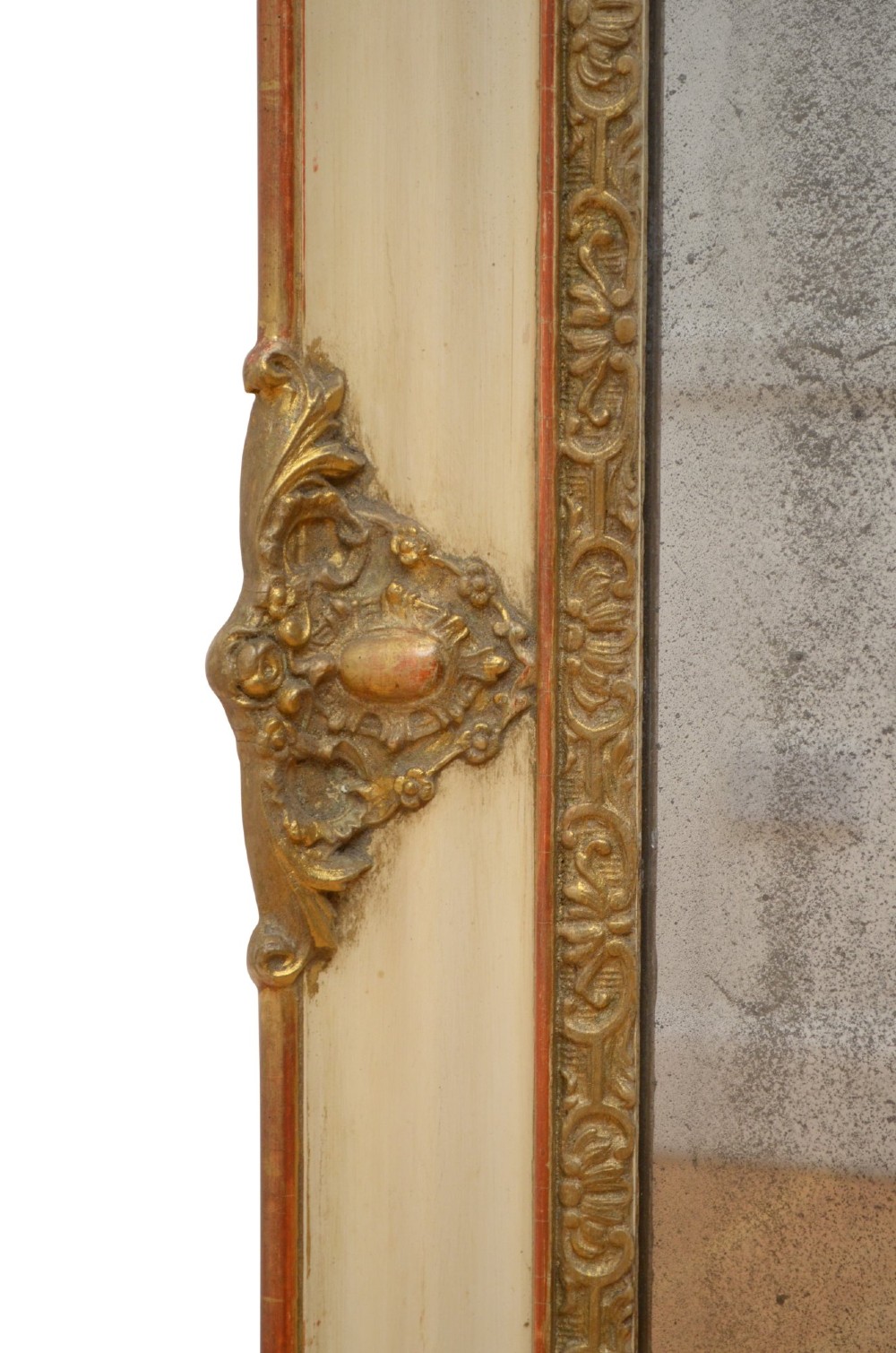 A rectangular 19th-century French Rococo wall mirror featuring an off-white frame decorated with ornate gold gilt gesso scrollwork and corner cartouches surrounding an aged glass plate. View VIII