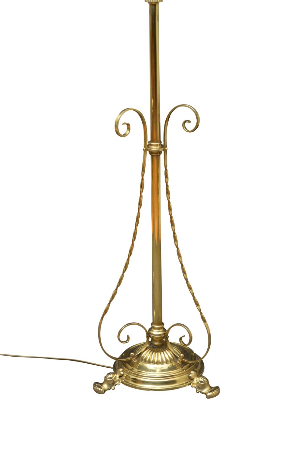 An antique Arts and Crafts brass standard floor lamp featuring a flared fabric shade, a height-adjustable central stem, scrollwork details, and a stepped circular base. View III