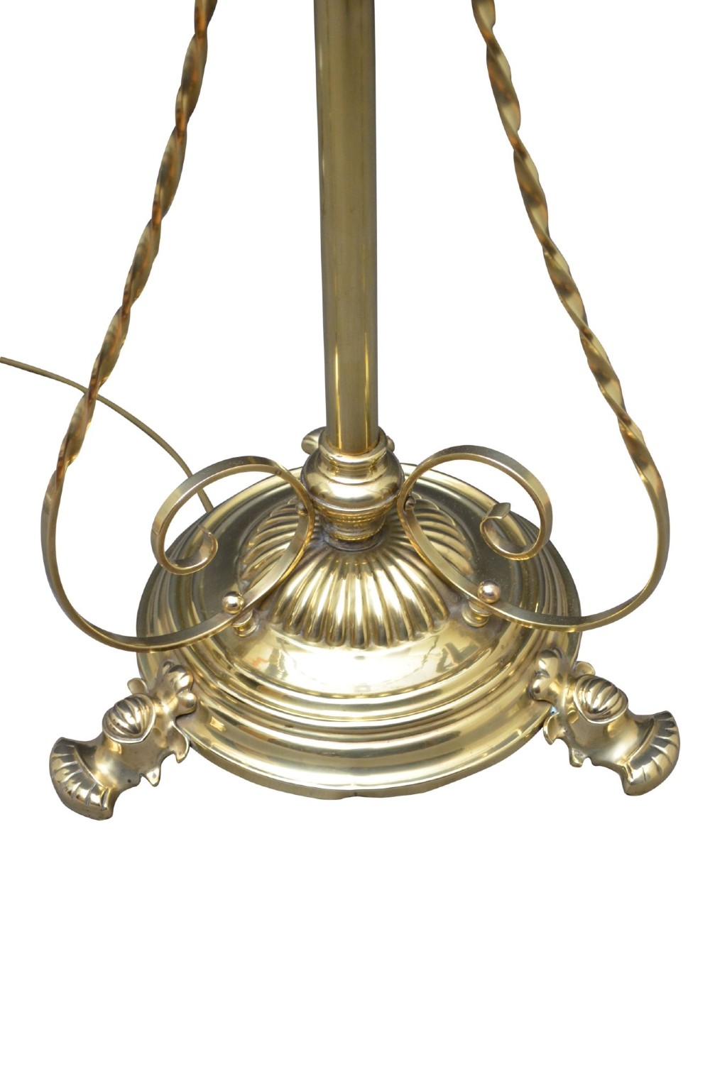 An antique Arts and Crafts brass standard floor lamp featuring a flared fabric shade, a height-adjustable central stem, scrollwork details, and a stepped circular base. View VI