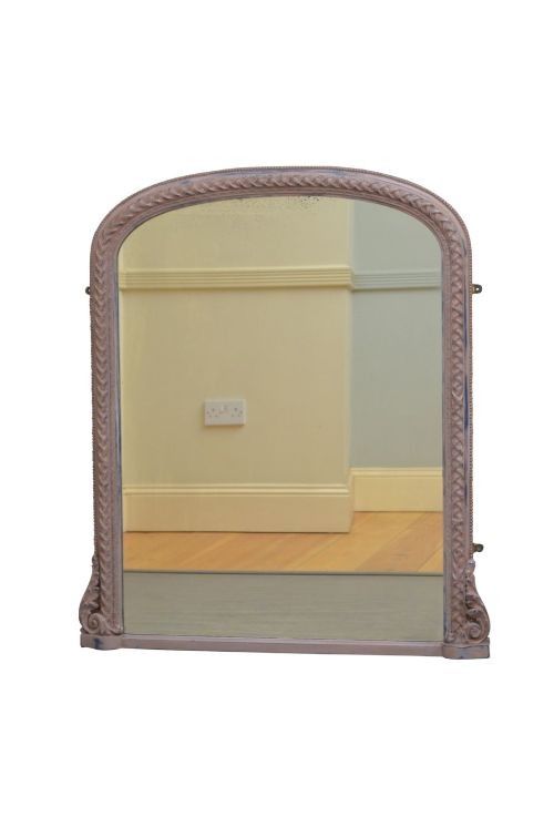 An arched French overmantel mirror featuring a carved wooden frame with a layered lilac and blue painted finish. View II