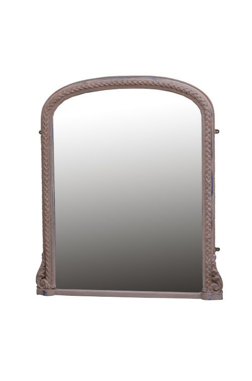 An arched French overmantel mirror featuring a carved wooden frame with a layered lilac and blue painted finish.
