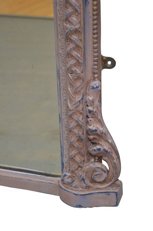 An arched French overmantel mirror featuring a carved wooden frame with a layered lilac and blue painted finish. View VII