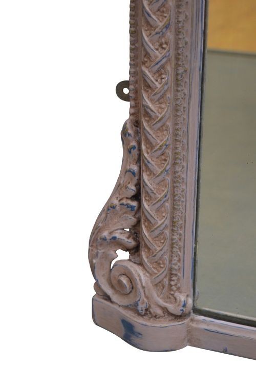 An arched French overmantel mirror featuring a carved wooden frame with a layered lilac and blue painted finish. View VIII