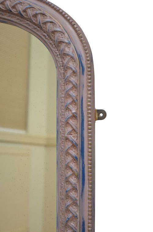 An arched French overmantel mirror featuring a carved wooden frame with a layered lilac and blue painted finish. View IX