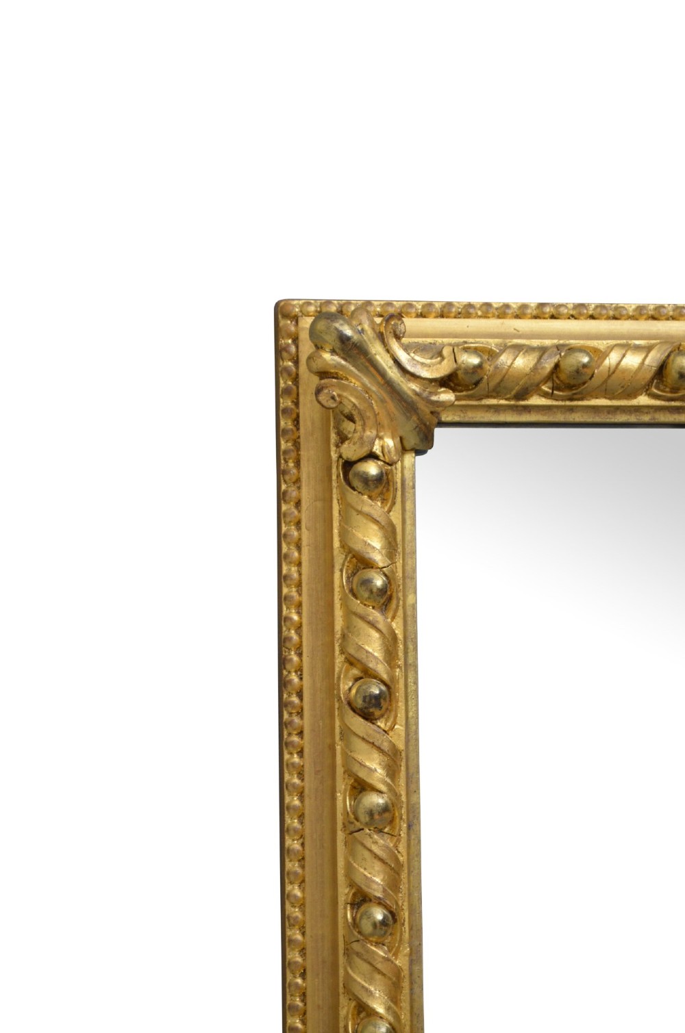 A rectangular Victorian giltwood overmantel mirror with carved rope twist moulding, corner scroll details, and original mirror glass. View III
