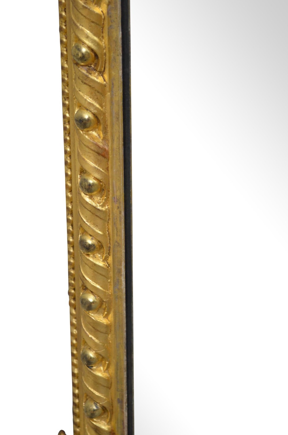 A rectangular Victorian giltwood overmantel mirror with carved rope twist moulding, corner scroll details, and original mirror glass. View V