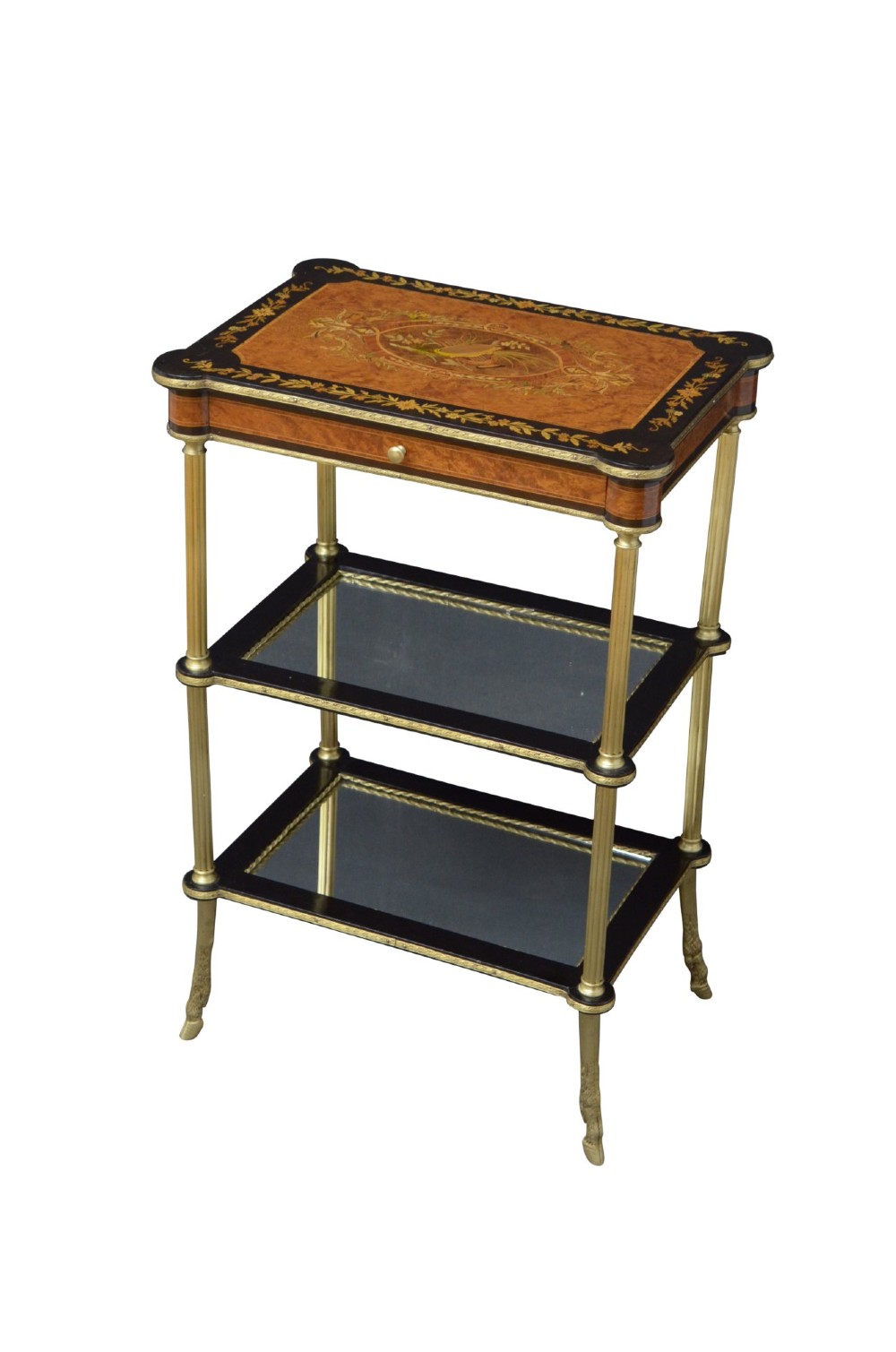 A late nineteenth-century French three-tier lamp table featuring a marquetry inlaid top with foliage border, slender brass columnar supports, two lower mirrored shelves, and brass hoof feet.