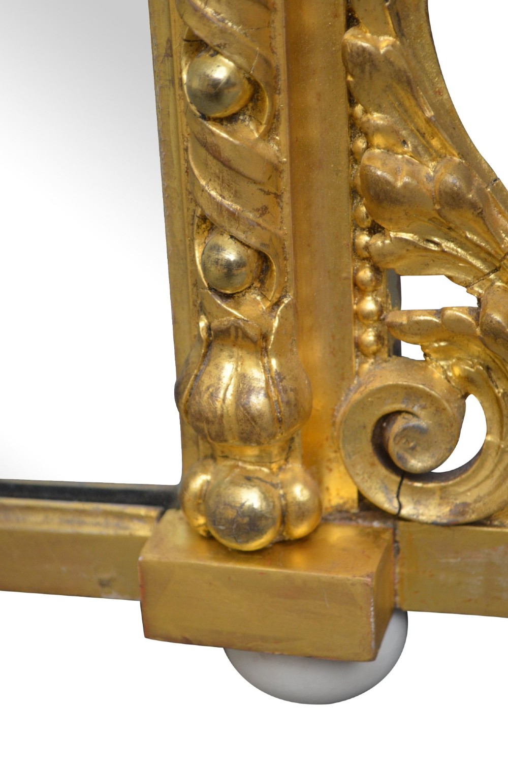 A rectangular Victorian giltwood overmantel mirror with carved rope twist moulding, corner scroll details, and original mirror glass. View XV