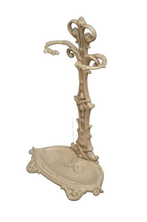 An Art Nouveau painted cream cast iron umbrella stand featuring organic scrollwork and an integrated drip tray at the base. View VII