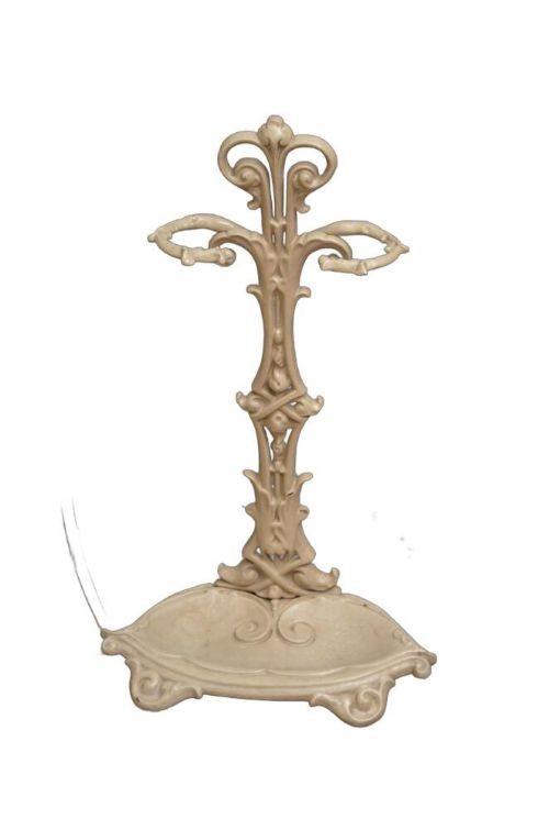 An Art Nouveau painted cream cast iron umbrella stand featuring organic scrollwork and an integrated drip tray at the base. View VIII