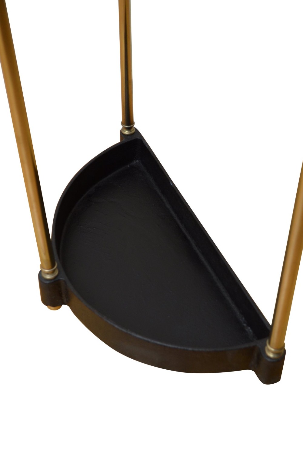 An antique brass demi-lune stick stand featuring three vertical supports, turned finials, a divided top rail, and a semi-circular black cast iron drip tray base. View VII