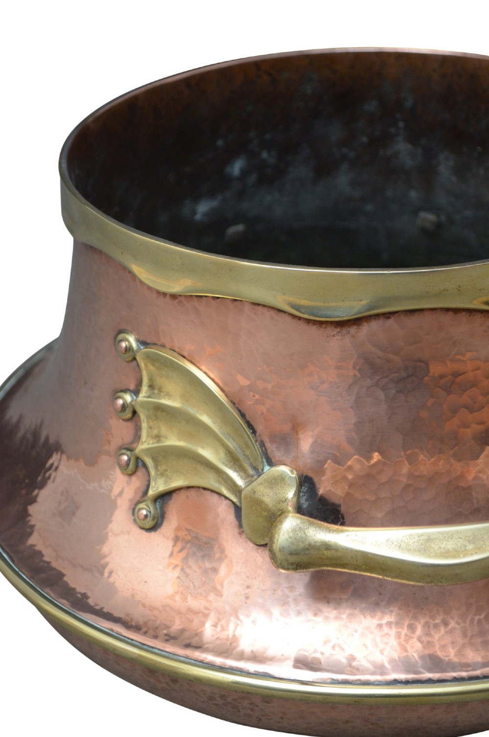 A hand-hammered 19th-century copper jardiniere featuring a broad rim with brass edging and winged cast brass side handles. View IV
