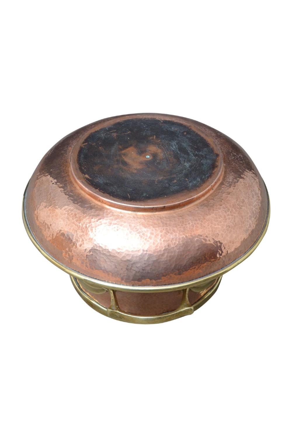 A hand-hammered 19th-century copper jardiniere featuring a broad rim with brass edging and winged cast brass side handles. View VI