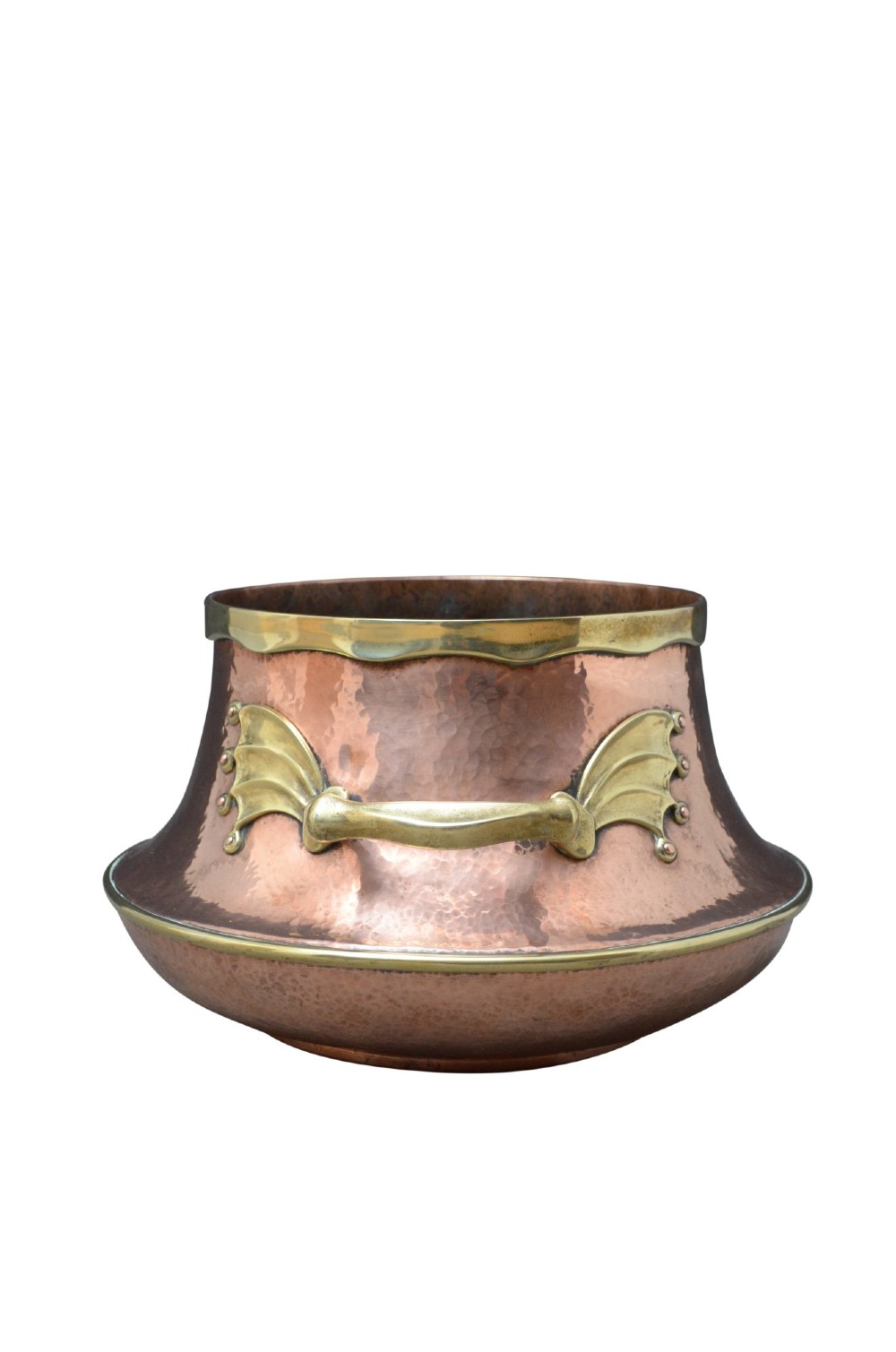 A hand-hammered 19th-century copper jardiniere featuring a broad rim with brass edging and winged cast brass side handles. View VIII