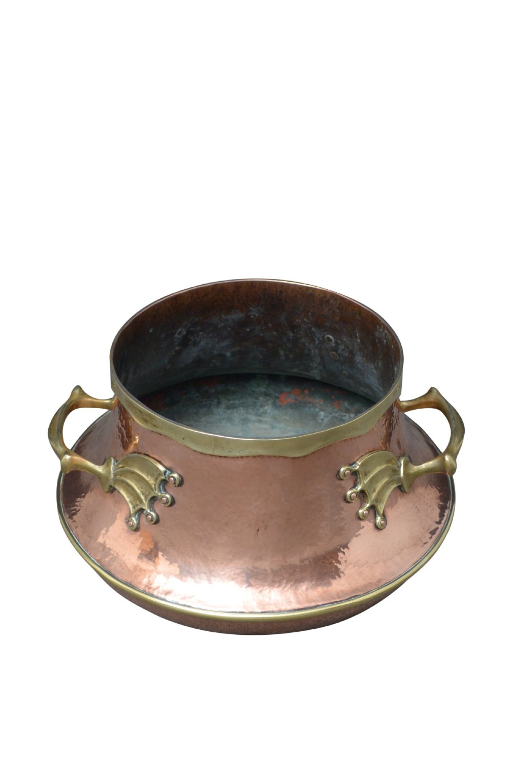 A hand-hammered 19th-century copper jardiniere featuring a broad rim with brass edging and winged cast brass side handles. View IX
