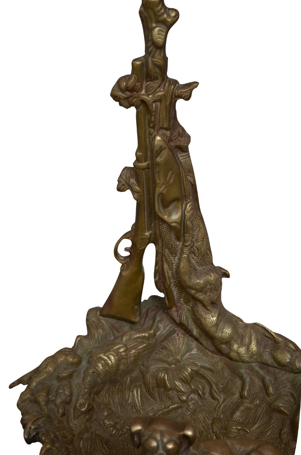 A cast brass stick stand featuring relief motifs of a resting hunting dog, crossed rifles, and foliage with a drip pan base. View VII