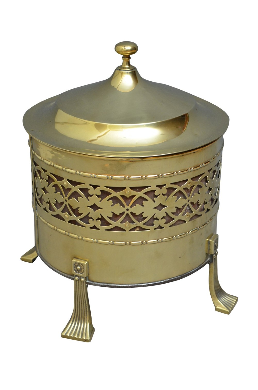 A cylindrical Edwardian polished brass coal bucket featuring a fretwork band, domed lid with finial, and three cast fluted feet. View V
