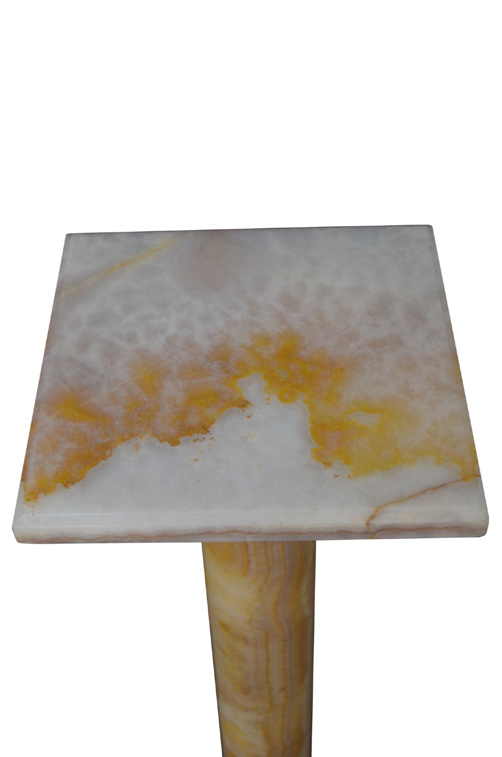 A tall cylindrical cream and amber onyx column featuring gilt bronze ormolu mounts at the top and base, set on a square plinth. View IV