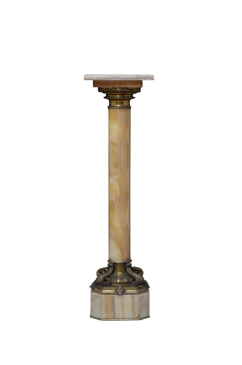 A tall cylindrical cream and amber onyx column featuring gilt bronze ormolu mounts at the top and base, set on a square plinth. View XII