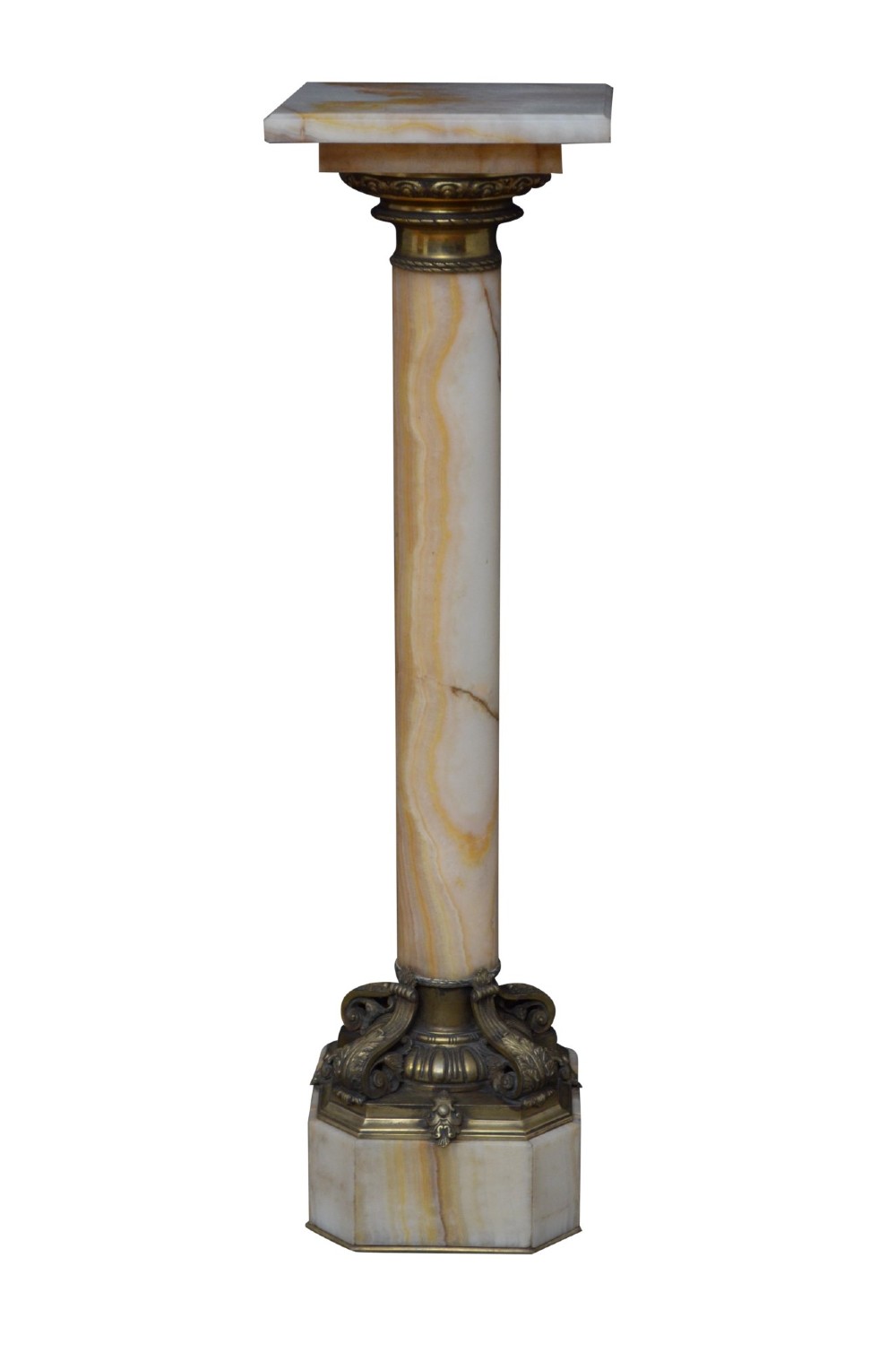 A tall cylindrical cream and amber onyx column featuring gilt bronze ormolu mounts at the top and base, set on a square plinth. View XIV