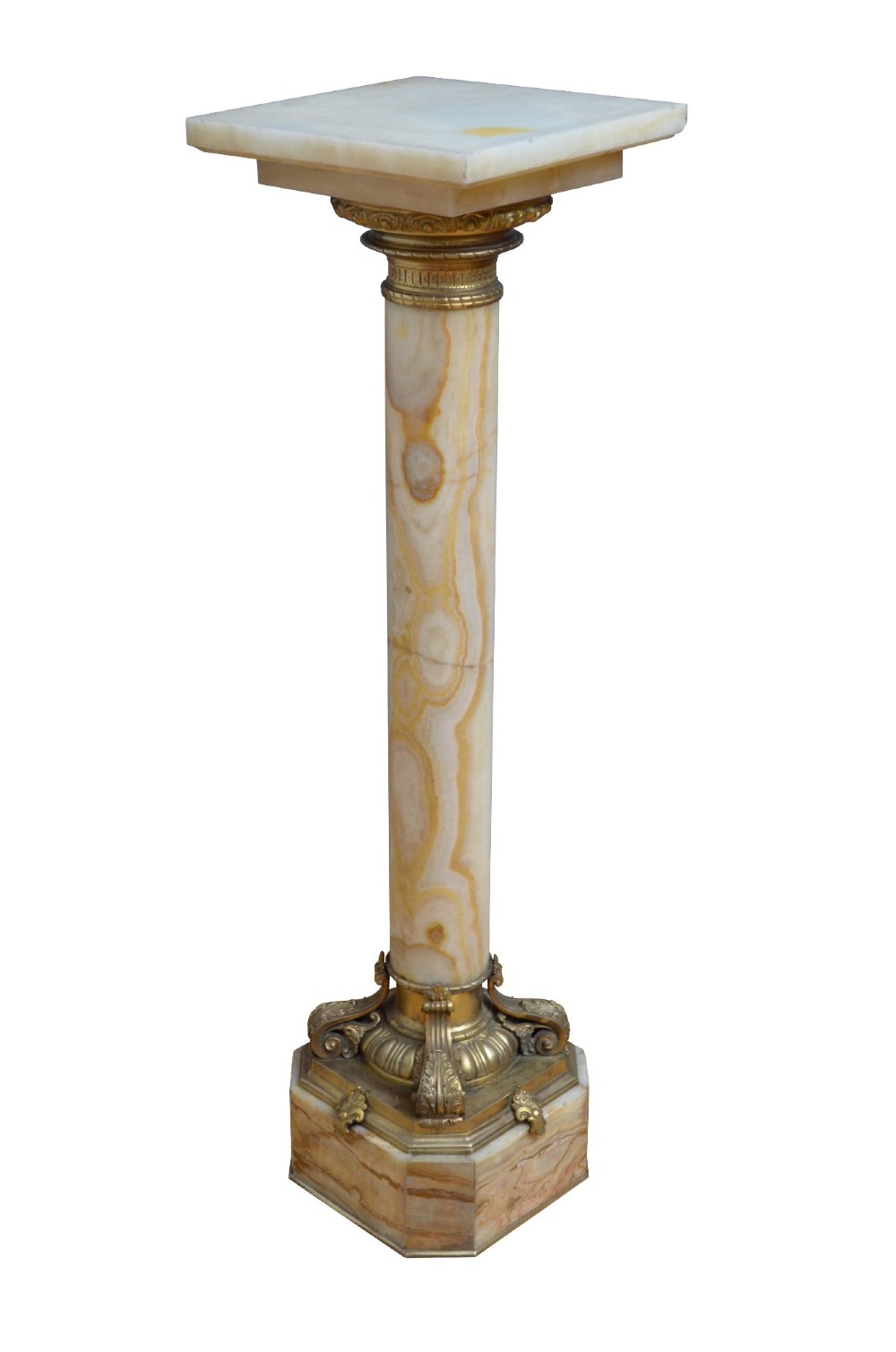 A pair of tall cylindrical onyx marble pedestals with square top plinths and ornate gilt ormolu collars and bases. View III