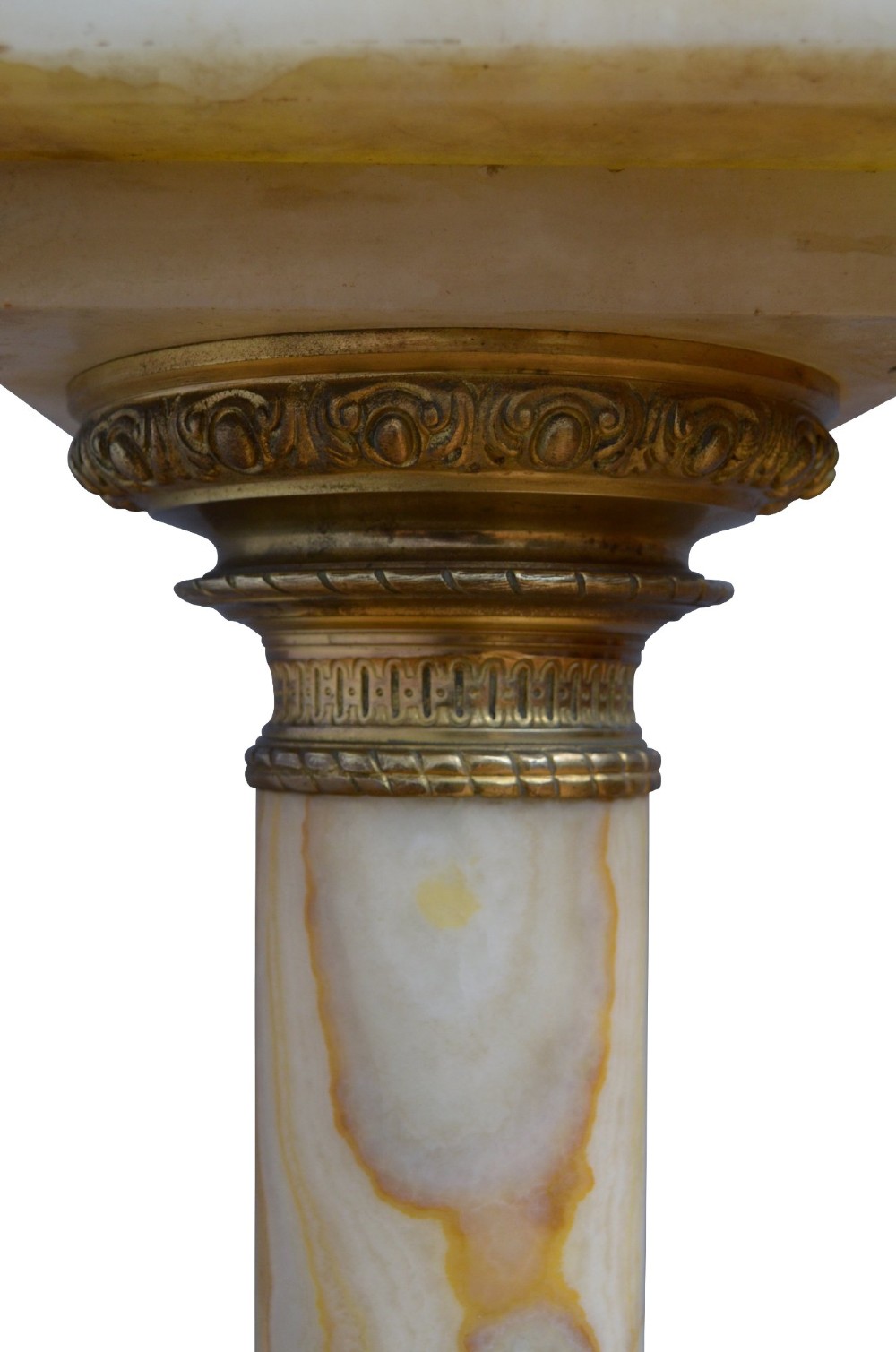 A pair of tall cylindrical onyx marble pedestals with square top plinths and ornate gilt ormolu collars and bases. View VII