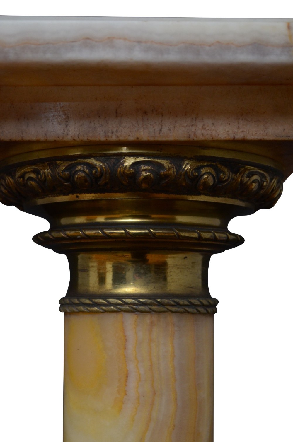 A pair of tall cylindrical onyx marble pedestals with square top plinths and ornate gilt ormolu collars and bases. View XI