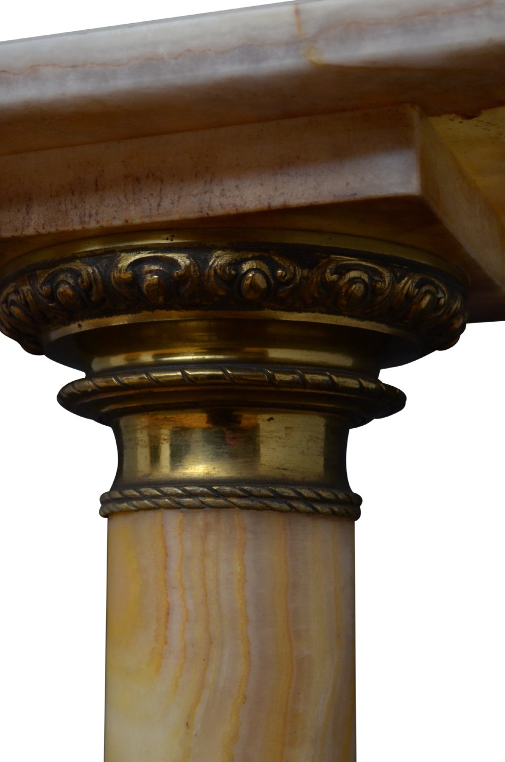 A pair of tall cylindrical onyx marble pedestals with square top plinths and ornate gilt ormolu collars and bases. View XII