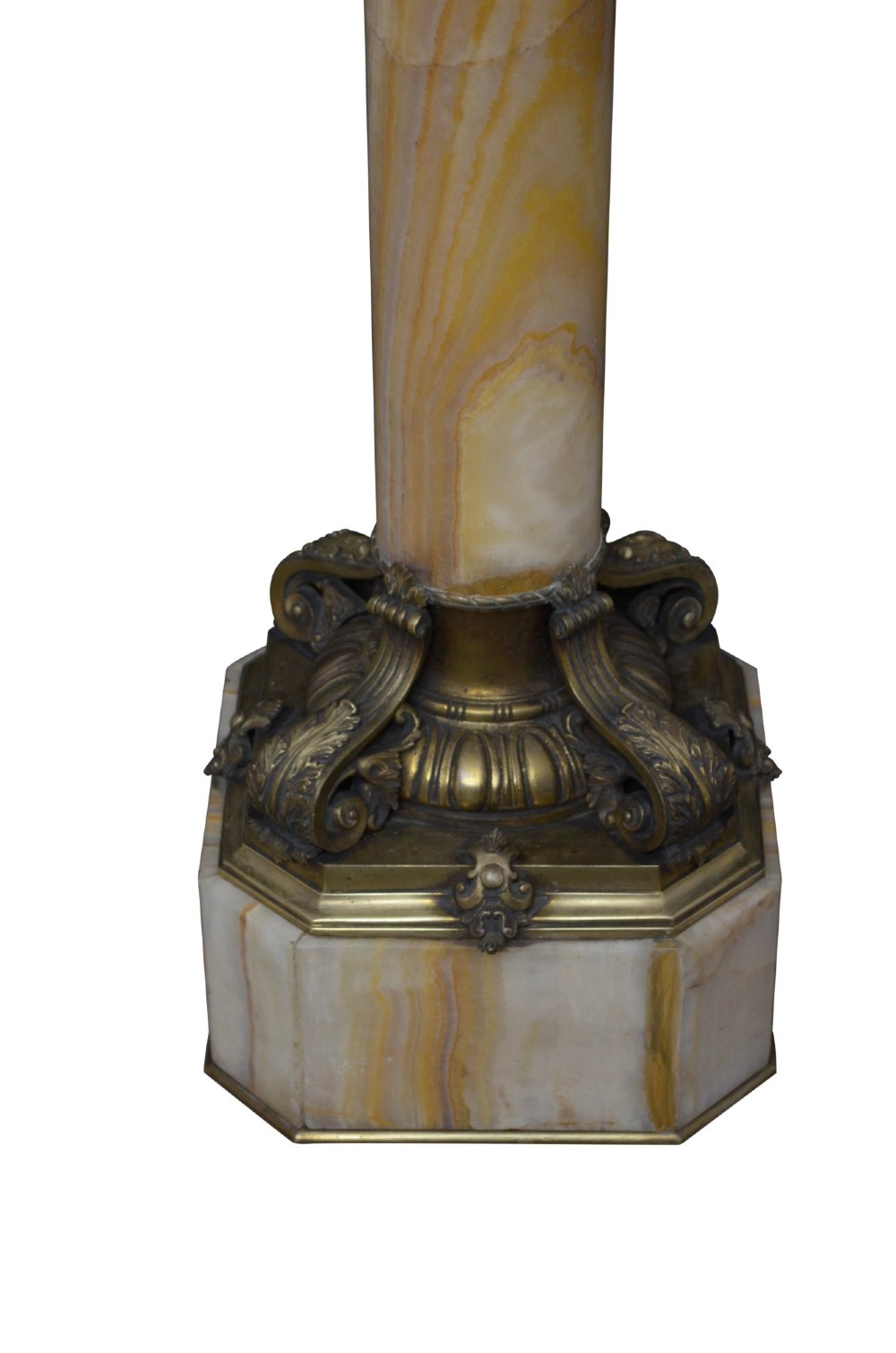 A pair of tall cylindrical onyx marble pedestals with square top plinths and ornate gilt ormolu collars and bases. View XIII