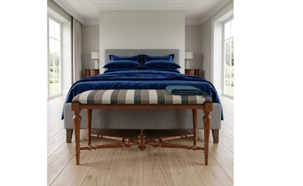 An Aesthetic Movement duet stool featuring a striped upholstered rectangular top, incised turned legs, and a central finial stretcher. View II