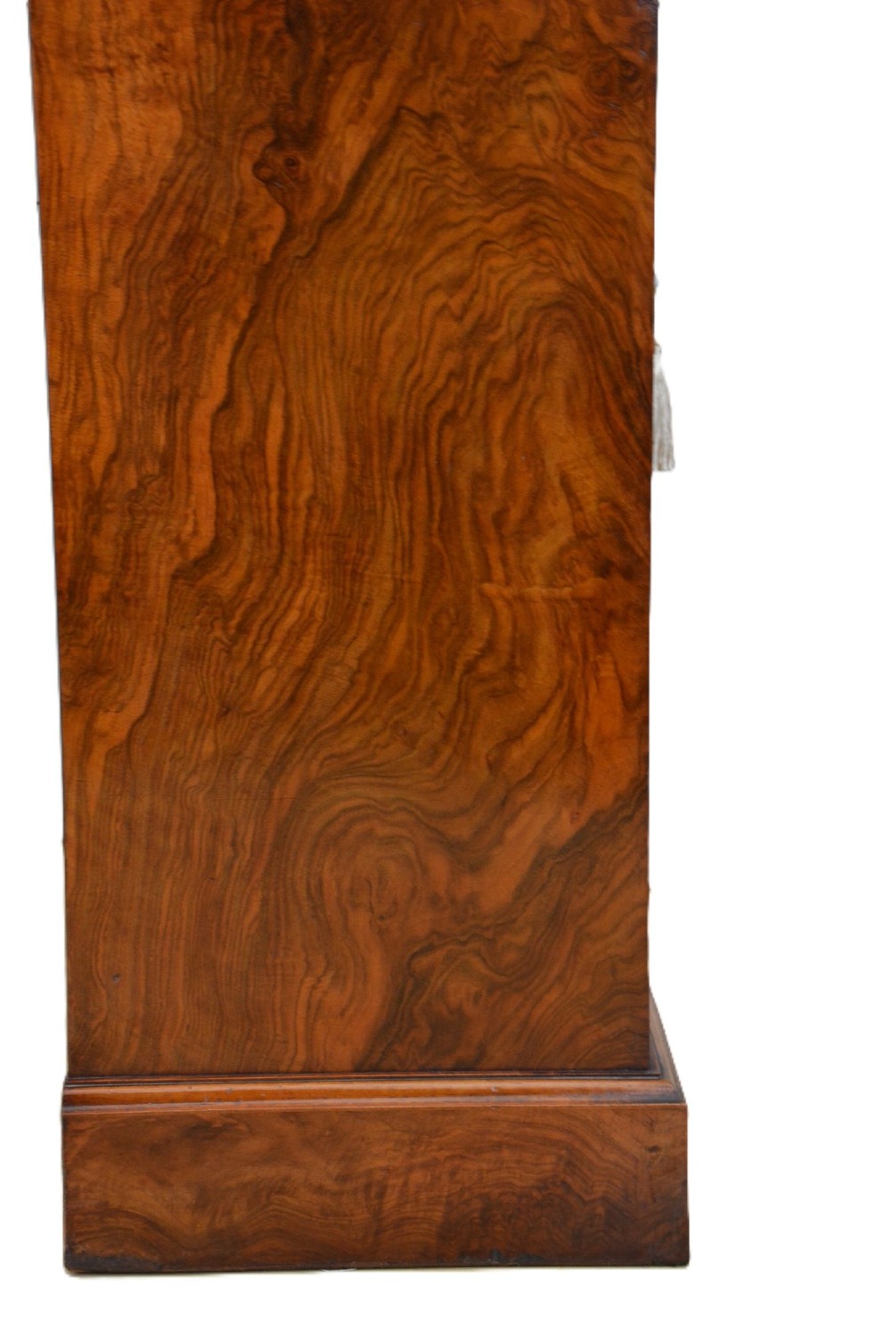 A Victorian figured walnut cabinet bookcase featuring two arched glazed doors, carved scroll corbels, and adjustable interior shelves. View VI