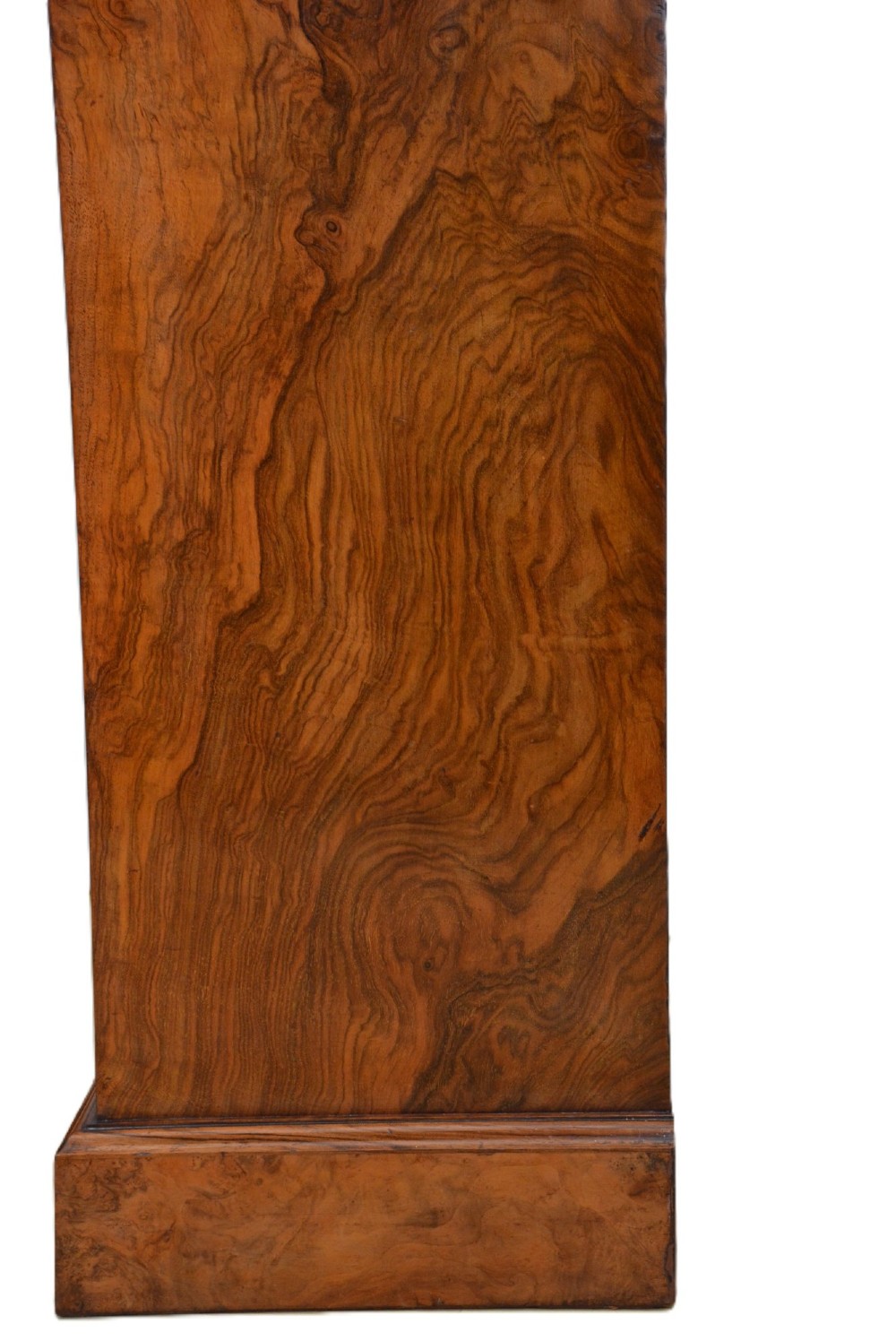 A Victorian figured walnut cabinet bookcase featuring two arched glazed doors, carved scroll corbels, and adjustable interior shelves. View VIII