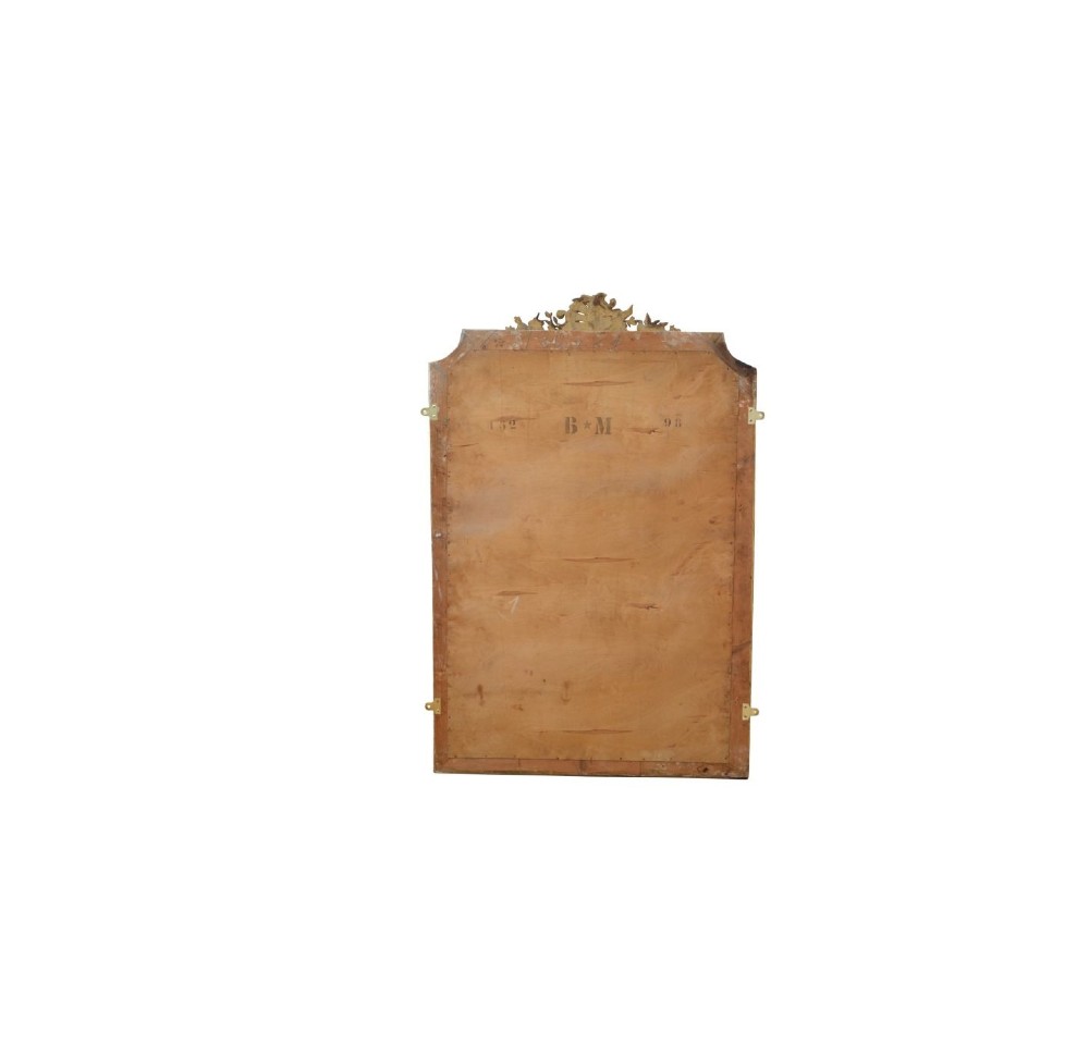 A tall French giltwood wall mirror featuring a carved foliate crest and a moulded gold frame. View VIII