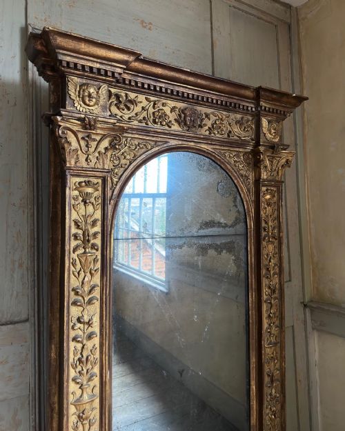 A LARGE BOLD ITALIAN CARVED GILTWOOD GESSO PIER MIRROR - ADDITIONAL PHOTO 1