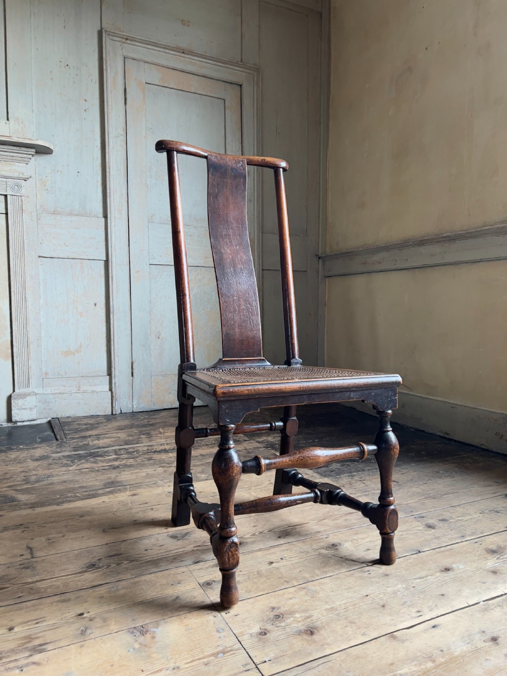 A Queen Anne period walnut caned 
