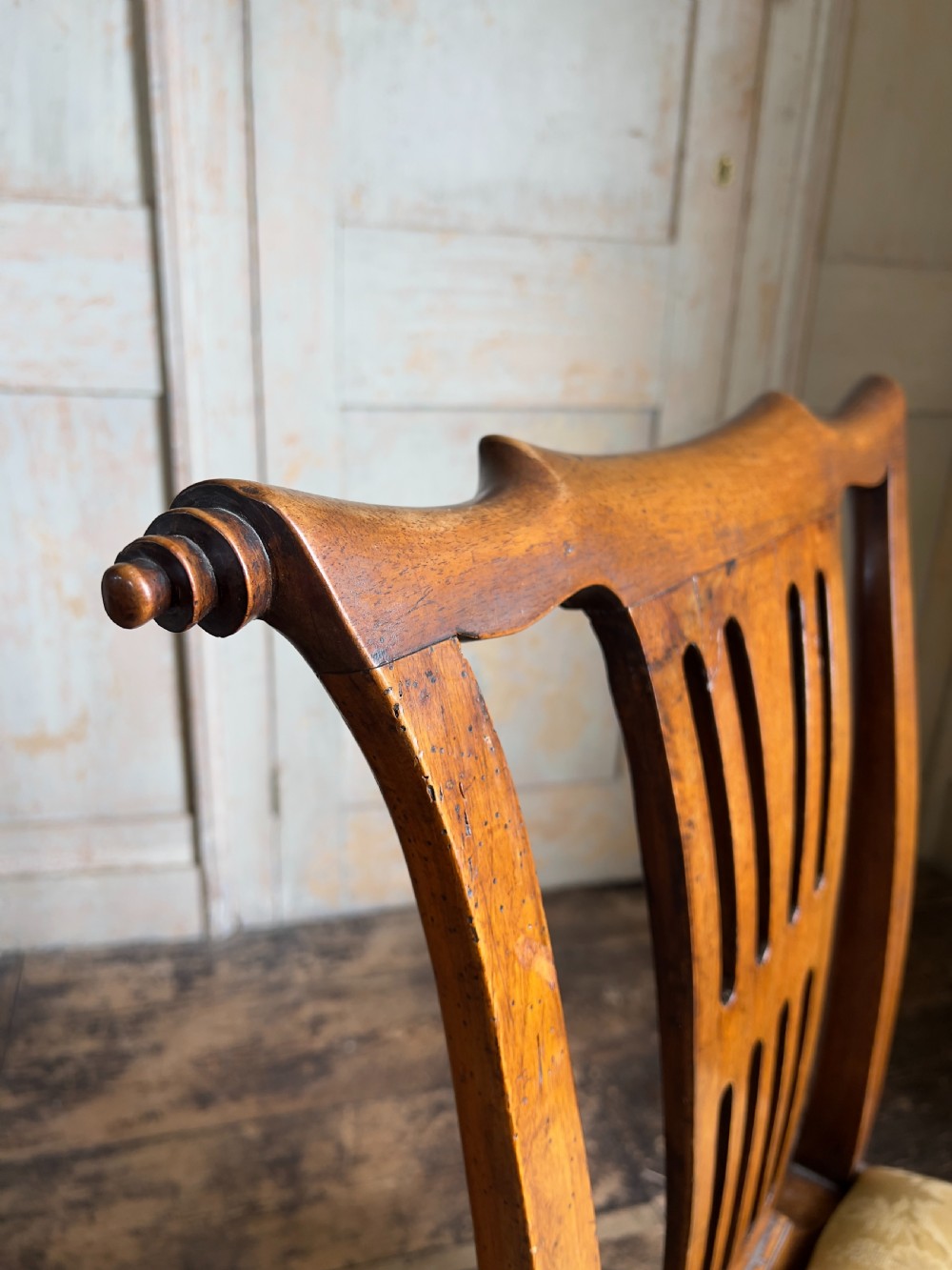A George II period walnut side chair featuring a carved splat back, yellow damask seat cushion, and cabriole legs with claw-and-ball feet. View IV