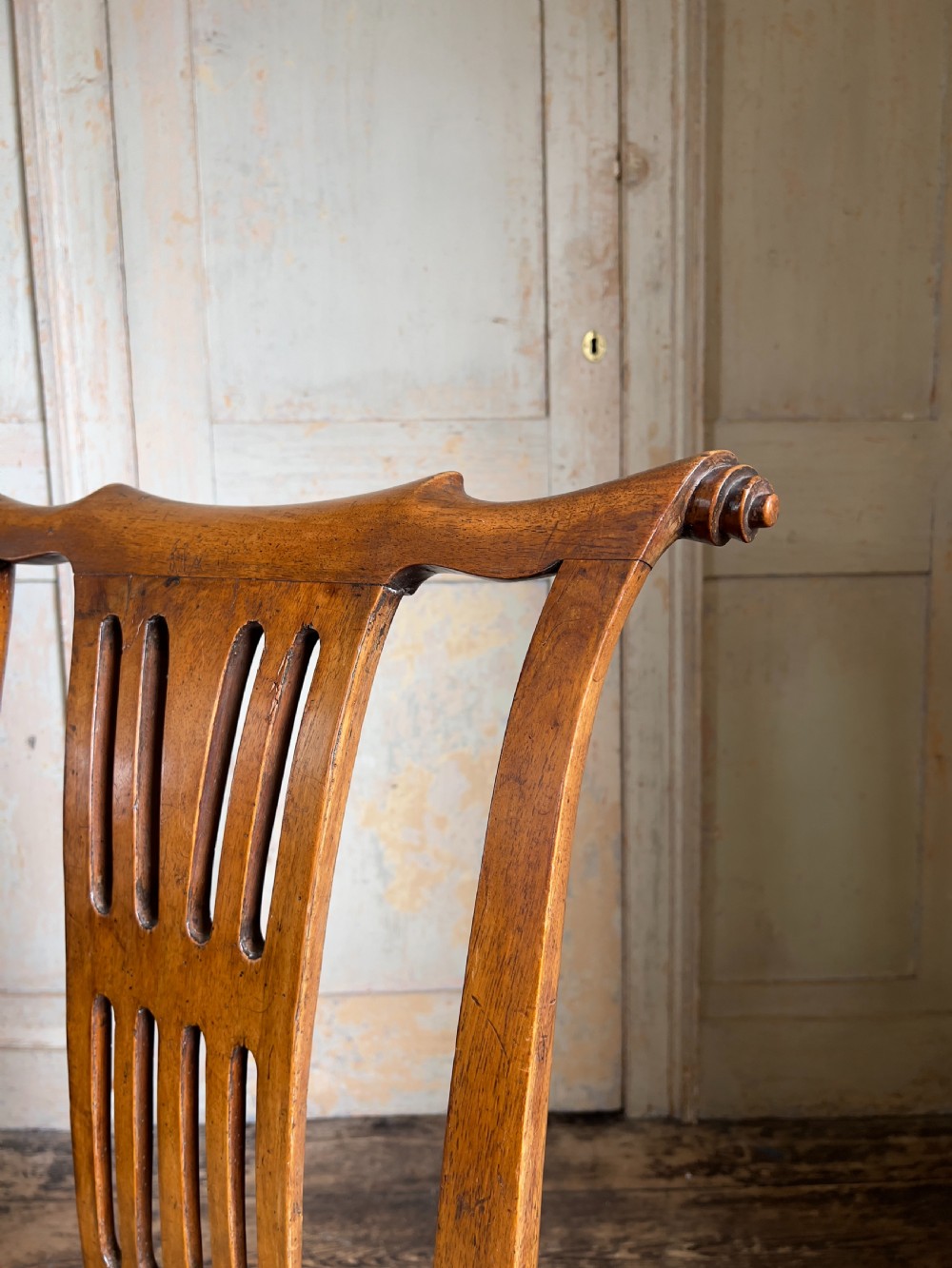 A George II period walnut side chair featuring a carved splat back, yellow damask seat cushion, and cabriole legs with claw-and-ball feet. View VI