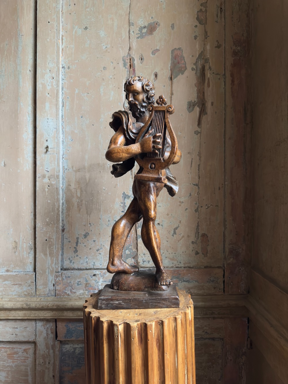 A rare 17th century carved oak figure of Orpheus