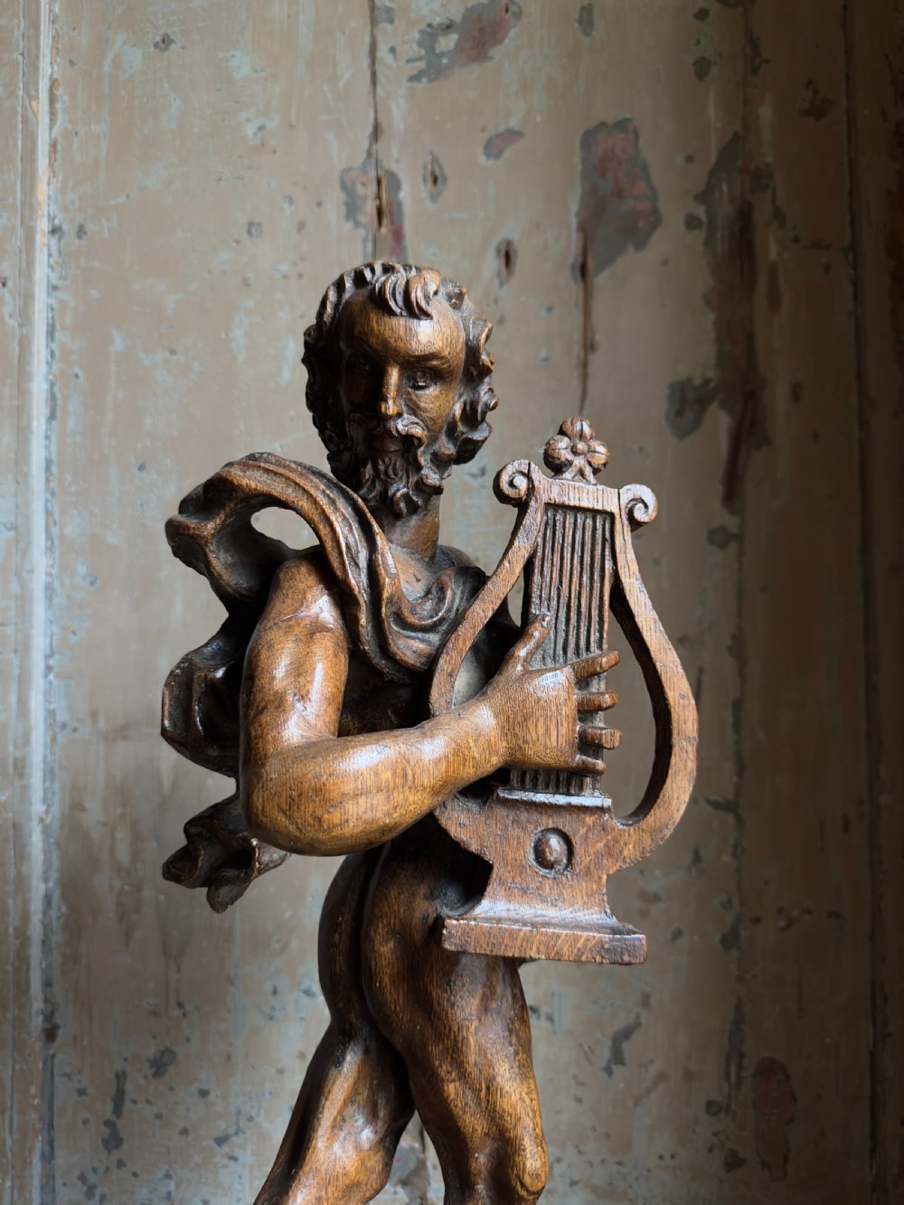 A rare 17th century carved oak figure of Orpheus View IV