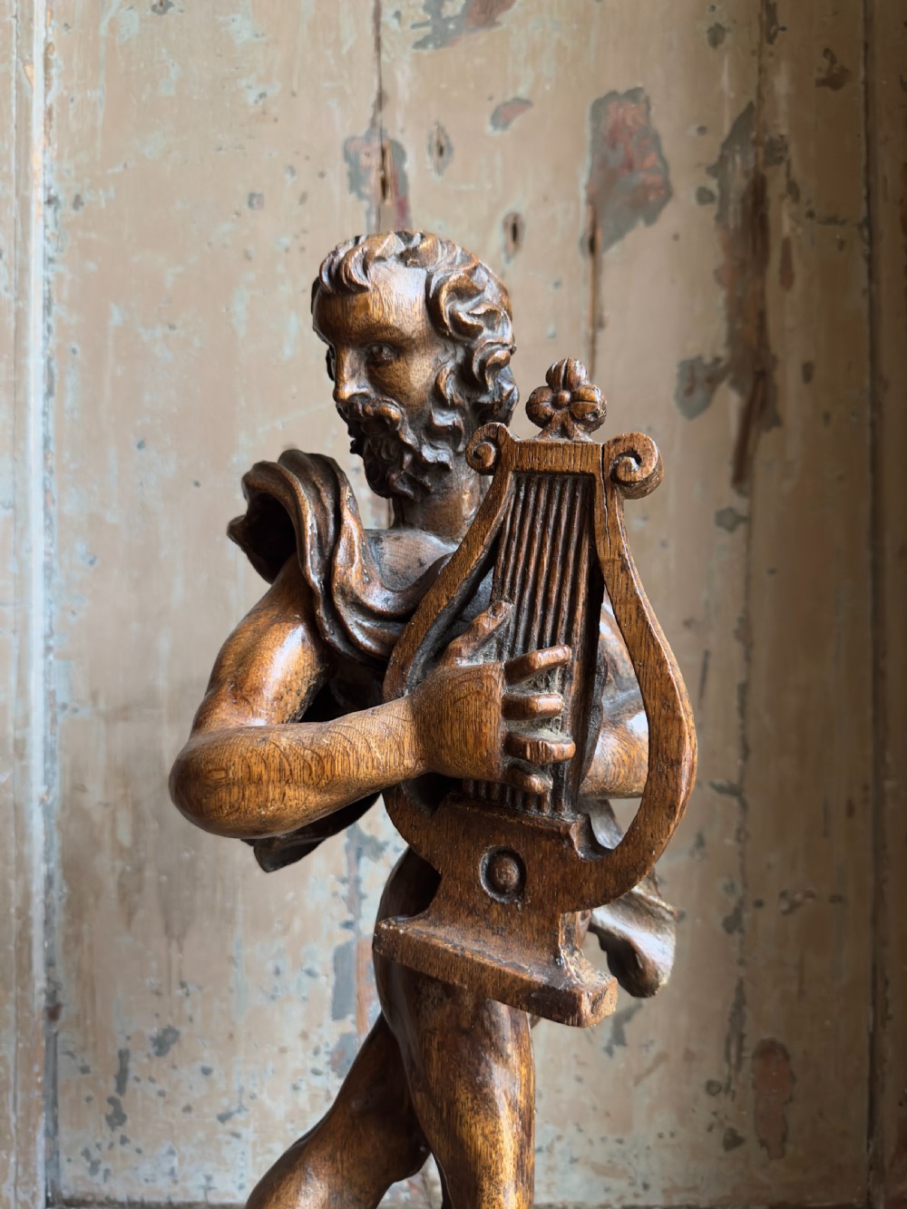 A rare 17th century carved oak figure of Orpheus View VI