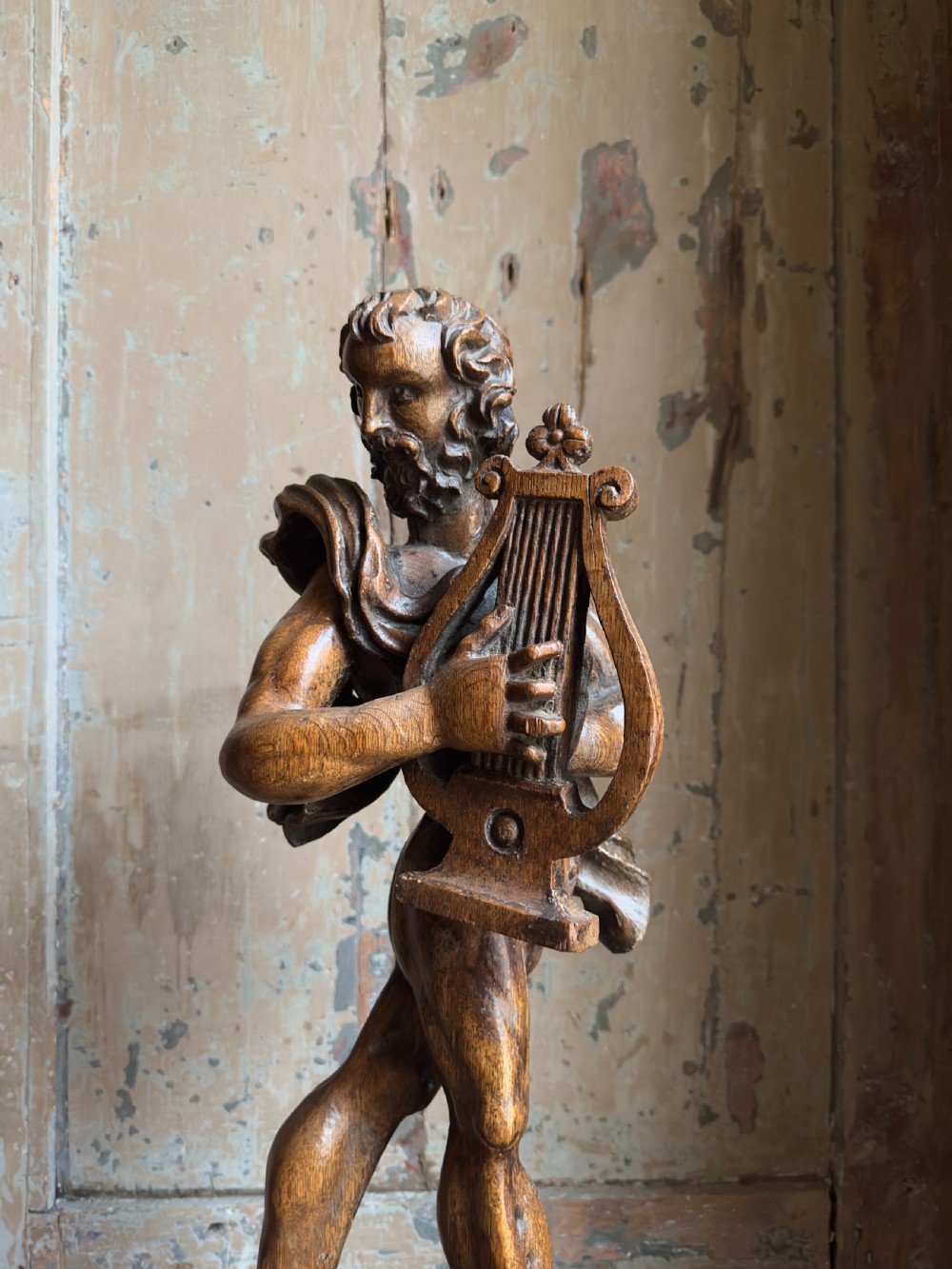 A rare 17th century carved oak figure of Orpheus View IX