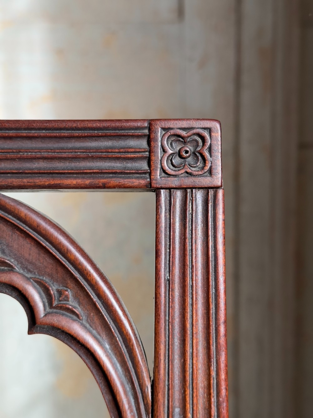 An antique Georgian mahogany side chair featuring carved Gothic tracery in the backrest and turned legs. View III
