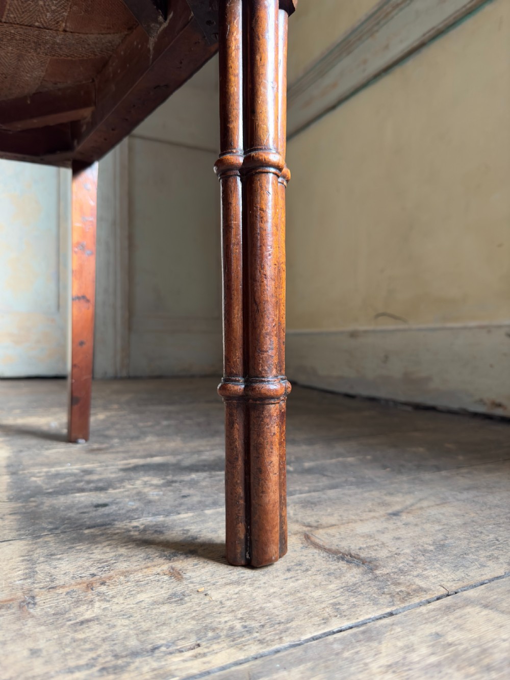 An antique Georgian mahogany side chair featuring carved Gothic tracery in the backrest and turned legs. View VI
