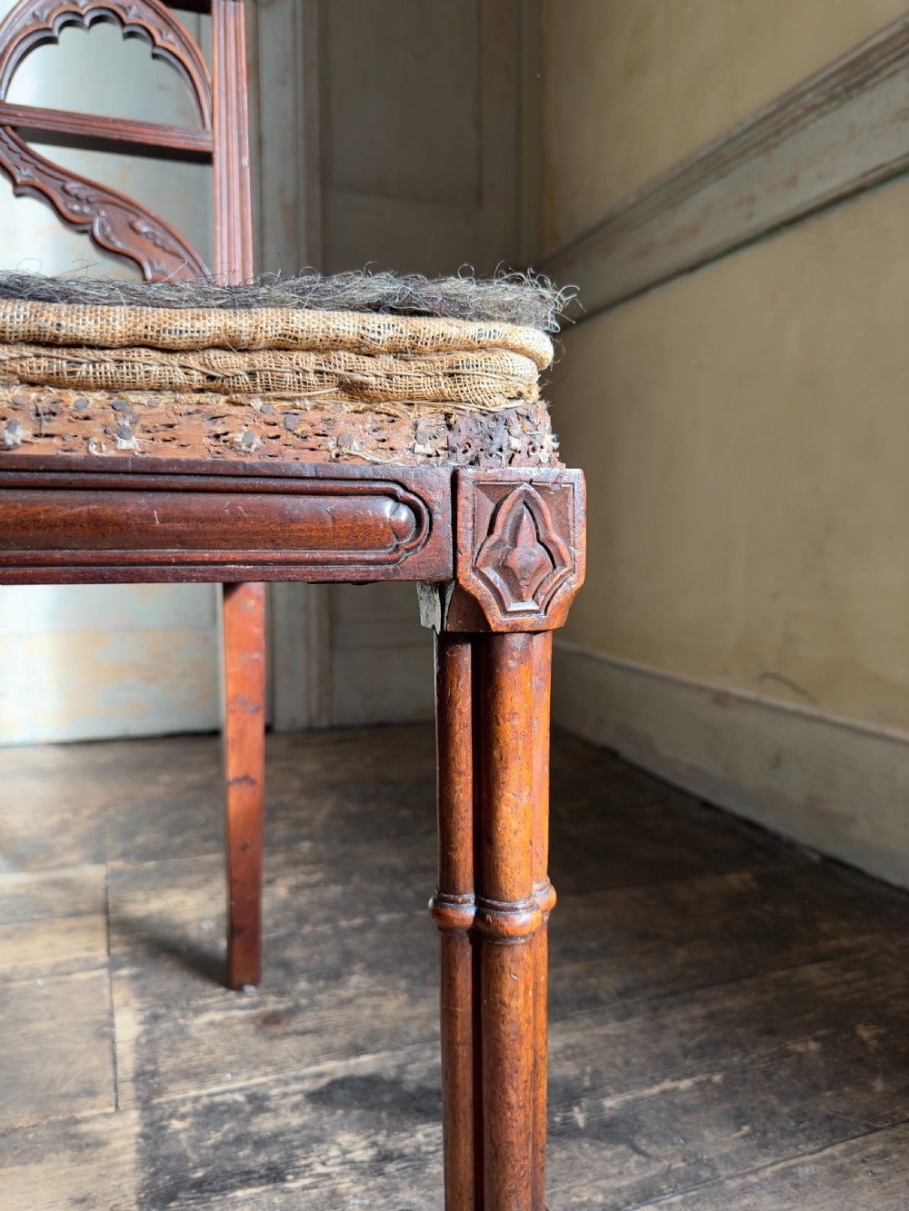 An antique Georgian mahogany side chair featuring carved Gothic tracery in the backrest and turned legs. View VIII